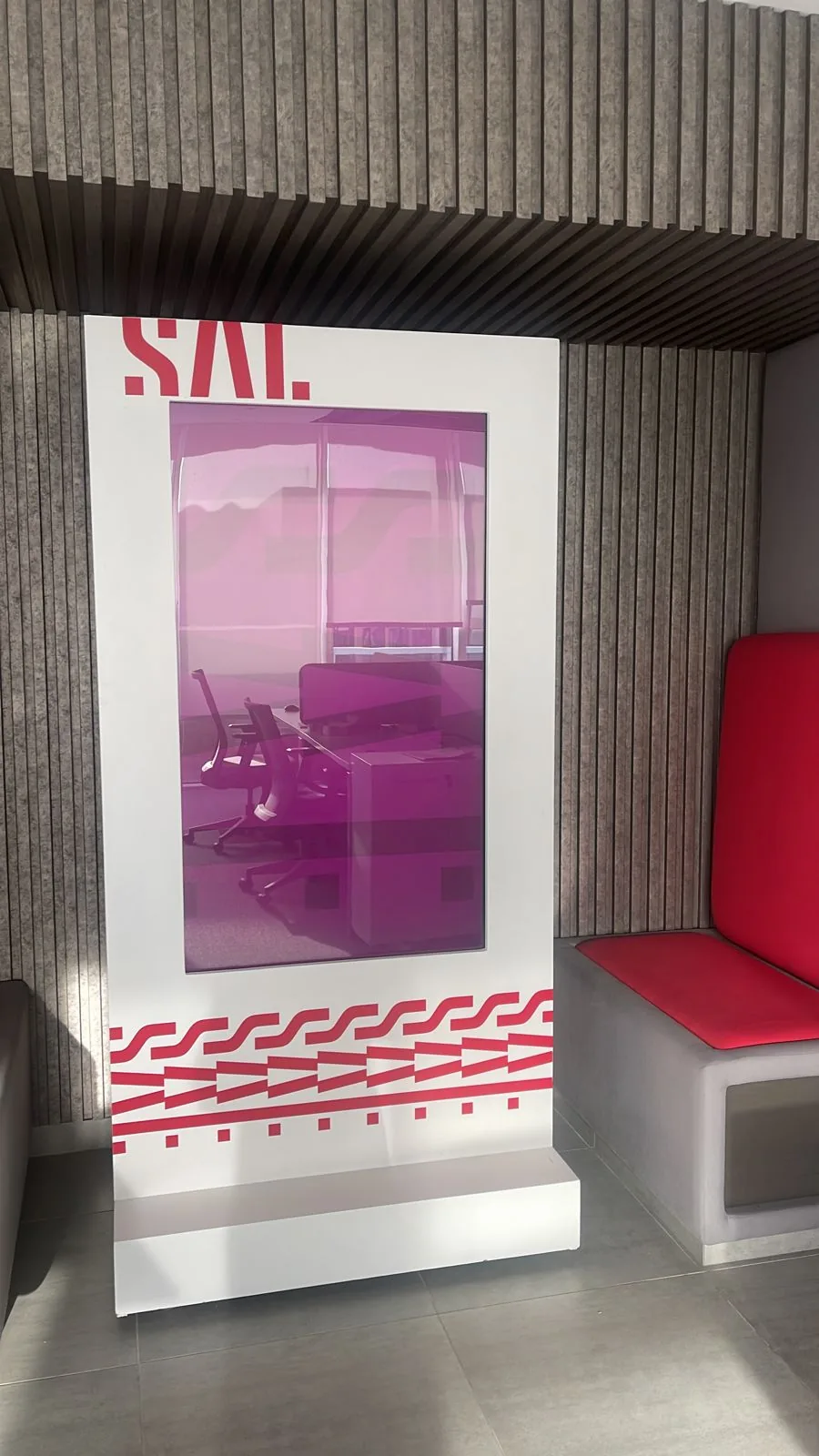 SAL branded digital signage totem in a lounge area